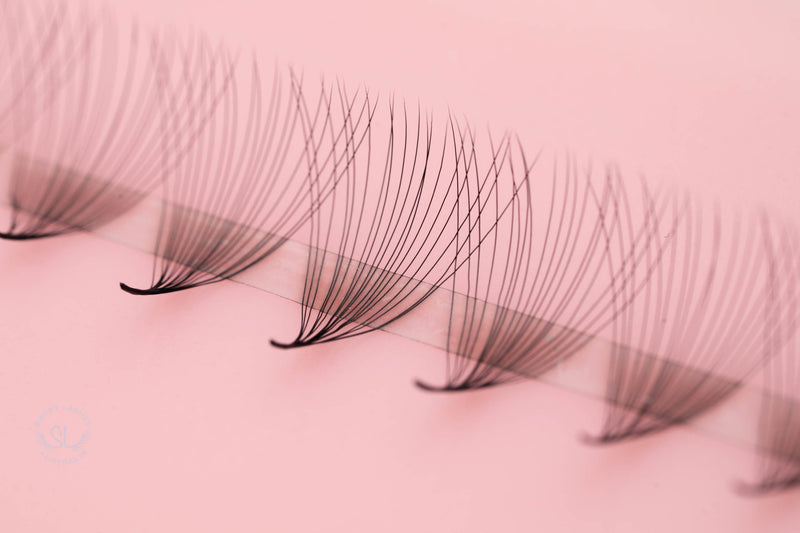 Super sharp and pointy base - 100% handcrafted by proficient lash artists - Eco-friendly trays - Materials: the highest quality Korean PBT fiber - 100% handmade so they are not identical - The fans are soft, black, and fluffy which will help you to create beautiful Volume sets easily in the same time as a Classic set. - Curls: C & D - Mixed Lengths: 9-16mm - Dimensions: 18D (0.03mm)